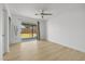 Bright bedroom with wood floors and sliding glass doors to backyard at 1455 E Tuckey Ln, Phoenix, AZ 85014