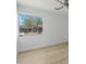 Bright bedroom with light wood floors and a window view at 1455 E Tuckey Ln, Phoenix, AZ 85014