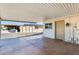 Covered patio with adjacent storage room at 20026 N 106Th Ave, Sun City, AZ 85373