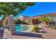 Beautiful backyard with a refreshing pool and slide at 36481 W Bilbao St, Maricopa, AZ 85138