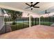 Covered patio with brick flooring, ceiling fans, and a view of the pool at 5050 E Charter Oak Rd, Scottsdale, AZ 85254