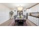 Elegant dining room with a large chandelier and farmhouse table at 5050 E Charter Oak Rd, Scottsdale, AZ 85254