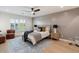 Comfortable bedroom with wood-look floors and an accent wall at 5050 E Charter Oak Rd, Scottsdale, AZ 85254