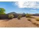 Landscaped backyard with gravel and desert plants at 31053 W Mitchell Dr, Buckeye, AZ 85396