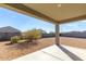 Covered patio overlooking a gravel backyard at 31053 W Mitchell Dr, Buckeye, AZ 85396