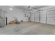 Spacious garage with overhead door and concrete floor at 813 W Press Rd, San Tan Valley, AZ 85140