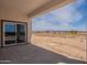 Covered patio with sliding doors and desert views at 2303 S 337Th Ave, Tonopah, AZ 85354