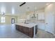 Modern kitchen with large island, white cabinets, and quartz countertops at 2303 S 337Th Ave, Tonopah, AZ 85354