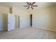 Spacious bedroom with tile flooring and ceiling fan at 2303 S 337Th Ave, Tonopah, AZ 85354