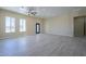 Bright living room with wood-look floors and ceiling fan at 2303 S 337Th Ave, Tonopah, AZ 85354