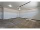 Unfinished garage with concrete flooring and high ceilings at 2303 S 337Th Ave, Tonopah, AZ 85354