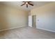 Spacious bedroom with ceiling fan and tile flooring at 2303 S 337Th Ave, Tonopah, AZ 85354