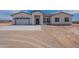 Single story home with 3 car garage and neutral exterior at 2303 S 337Th Ave, Tonopah, AZ 85354