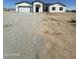 Newly built single-story home with a large driveway at 2303 S 337Th Ave, Tonopah, AZ 85354