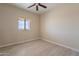 Spacious bedroom with ceiling fan and tile flooring at 2303 S 337Th Ave, Tonopah, AZ 85354