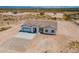 Aerial view of a new construction home with a two car garage at 2303 S 337Th Ave, Tonopah, AZ 85354