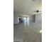 Open concept living and kitchen area with tile floors at 2303 S 337Th Ave, Tonopah, AZ 85354