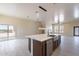 Modern kitchen with island, stainless steel appliances, and white cabinets at 2303 S 337Th Ave, Tonopah, AZ 85354