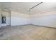 Bright and spacious garage with neutral colored flooring and walls at 2303 S 337Th Ave, Tonopah, AZ 85354