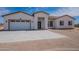 New single story home with a 3-car garage and desert landscaping at 2303 S 337Th Ave, Tonopah, AZ 85354