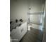 Modern bathroom with soaking tub, marble countertop, and grey tile floors at 2303 S 337Th Ave, Tonopah, AZ 85354