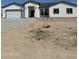 New construction home with stucco exterior and tile roof at 2303 S 337Th Ave, Tonopah, AZ 85354