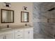 Elegant bathroom with double vanity and marble shower at 2303 S 337Th Ave, Tonopah, AZ 85354