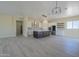 Open concept kitchen with island, stainless steel appliances, and tile floors at 2303 S 337Th Ave, Tonopah, AZ 85354
