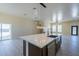 Modern kitchen with island, stainless steel appliances, and white cabinets at 2303 S 337Th Ave, Tonopah, AZ 85354
