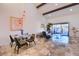 Open living room with high ceilings, dining area, and patio access at 10068 E Turquoise Ave, Scottsdale, AZ 85258