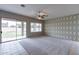 Bright Gathering room with backyard access and ceiling fan at 7951 E Posada Ave, Mesa, AZ 85212