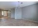 Living room with tile floors, neutral walls, and a ceiling fan at 7951 E Posada Ave, Mesa, AZ 85212