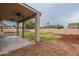 Covered patio and grassy backyard at 7951 E Posada Ave, Mesa, AZ 85212