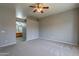 Bright bedroom with ceiling fan and carpet flooring at 7951 E Posada Ave, Mesa, AZ 85212