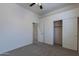 Spacious bedroom with double door closet and carpet flooring at 7951 E Posada Ave, Mesa, AZ 85212