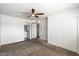 Main bedroom with carpet, ceiling fan, and ensuite bathroom at 5088 N 83Rd St, Scottsdale, AZ 85250
