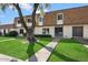 Townhouse with grassy area and walkway at 5088 N 83Rd St, Scottsdale, AZ 85250