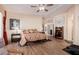 Main bedroom with hardwood floors, large windows, and ensuite bathroom at 4055 N Recker Rd # 29, Mesa, AZ 85215