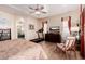 Bright bedroom with large bed, treadmill, and bathroom access at 4055 N Recker Rd # 29, Mesa, AZ 85215