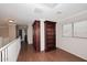 Upstairs hallway with built-in bookcase and wood flooring at 4321 E Desert Sky Ct, Cave Creek, AZ 85331