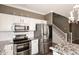 Modern kitchen with stainless steel appliances and granite countertops at 4321 E Desert Sky Ct, Cave Creek, AZ 85331