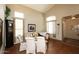 Elegant dining room with hardwood floors and large windows at 4321 E Desert Sky Ct, Cave Creek, AZ 85331