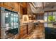 Gourmet kitchen with island, double ovens, custom cabinetry, and granite countertops at 40523 N 102Nd Pl, Scottsdale, AZ 85262