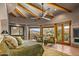 Main bedroom with mountain views, sitting area and a ceiling fan at 40523 N 102Nd Pl, Scottsdale, AZ 85262