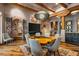 Open dining area with a unique wood table and stunning wood beam ceiling at 40523 N 102Nd Pl, Scottsdale, AZ 85262