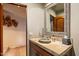 Elegant bathroom with stone sink and ornate mirror at 40523 N 102Nd Pl, Scottsdale, AZ 85262