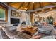 Spacious living room featuring a large stone fireplace and comfortable seating at 40523 N 102Nd Pl, Scottsdale, AZ 85262