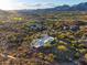 Aerial view of house and surrounding landscape, golf course visible at 40523 N 102Nd Pl, Scottsdale, AZ 85262