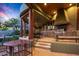 Outdoor kitchen and dining area with built-in grill and cabinets at 40523 N 102Nd Pl, Scottsdale, AZ 85262
