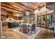 Kitchen and dining area with wood beams, an island, and access to a patio at 40523 N 102Nd Pl, Scottsdale, AZ 85262